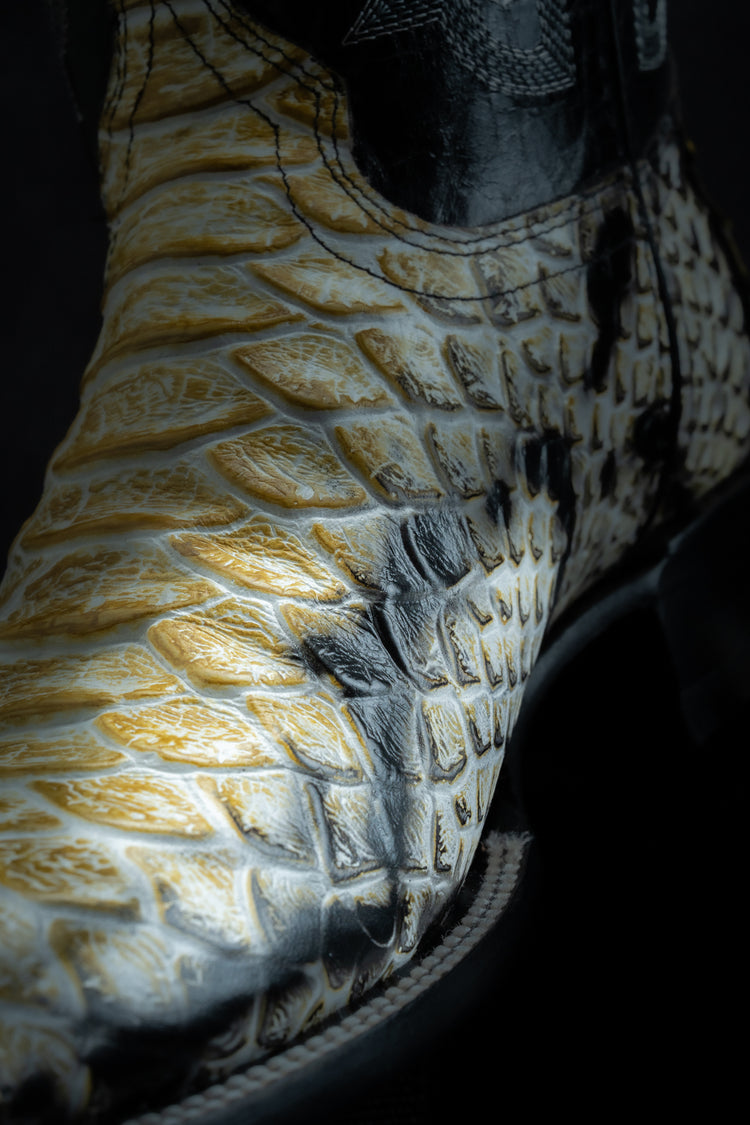 Western boot in Natural Python Monster style, square toe, leather sole and heel.