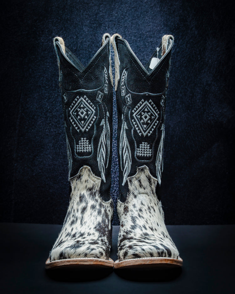 Original leather boot for women with black and white hair-on-hide and tall shaft.