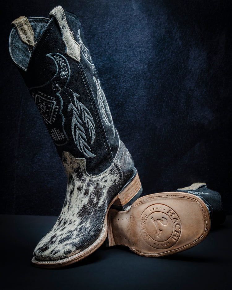 Original leather boot for women with black and white hair-on-hide and tall shaft.