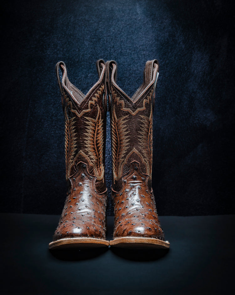 Ostrich-style plastisol leather boot for men, brown color.